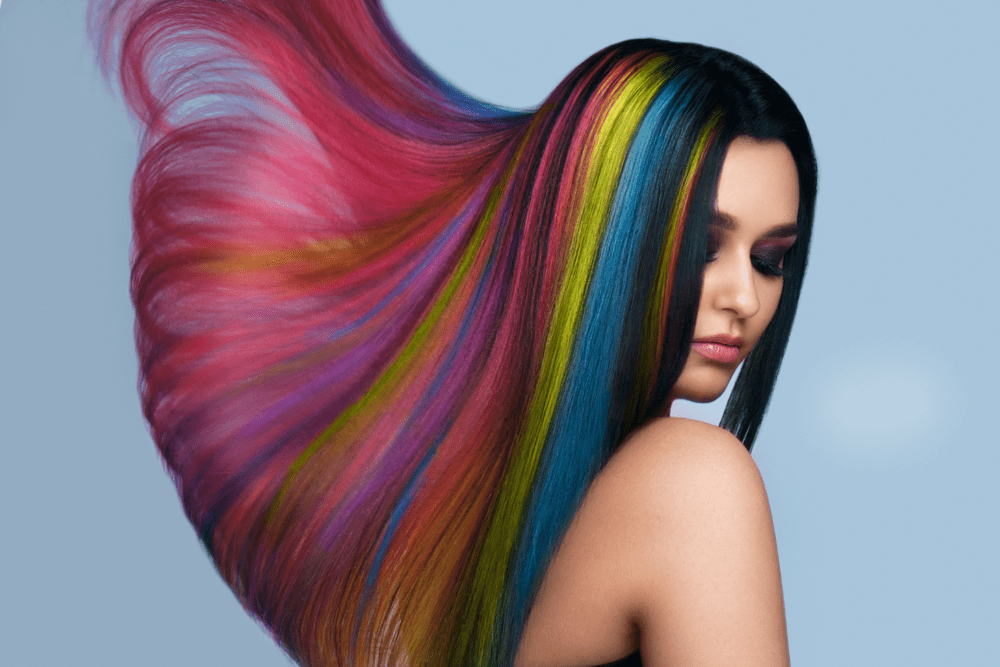 Portrait of beautiful woman with rainbow-colored hair