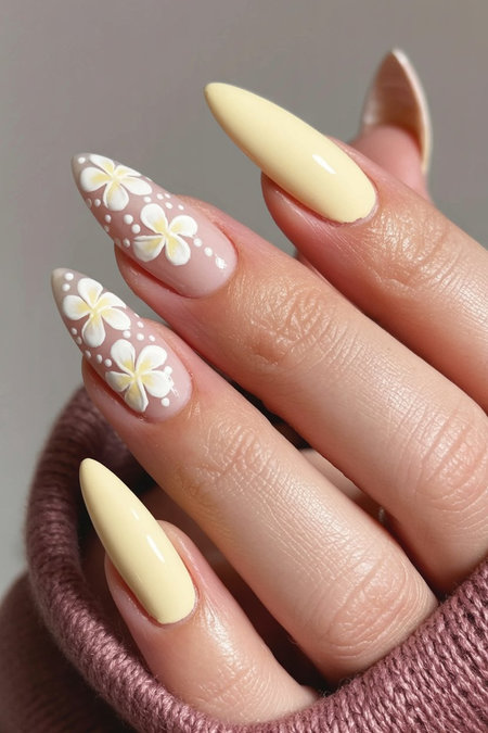 21 Stiletto yellow nails white floral accent nude base_pin