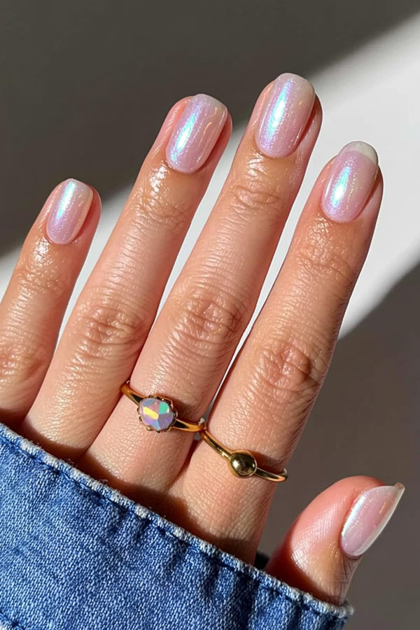 13 Iridescent pearl nails with holographic shimmer that shifts from pink to blue in the light_bp