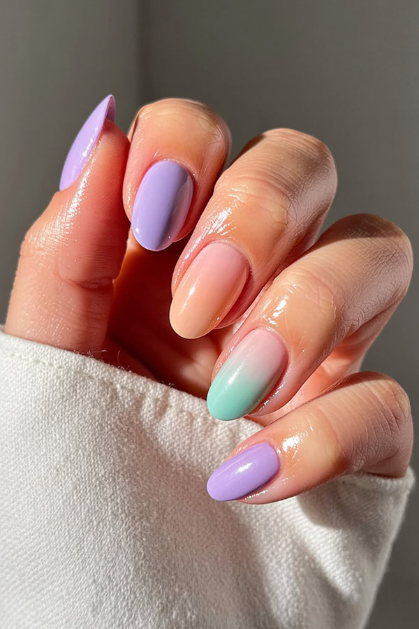 29 Soft pastel ombre nails blending lavender, peach, and mint_bp